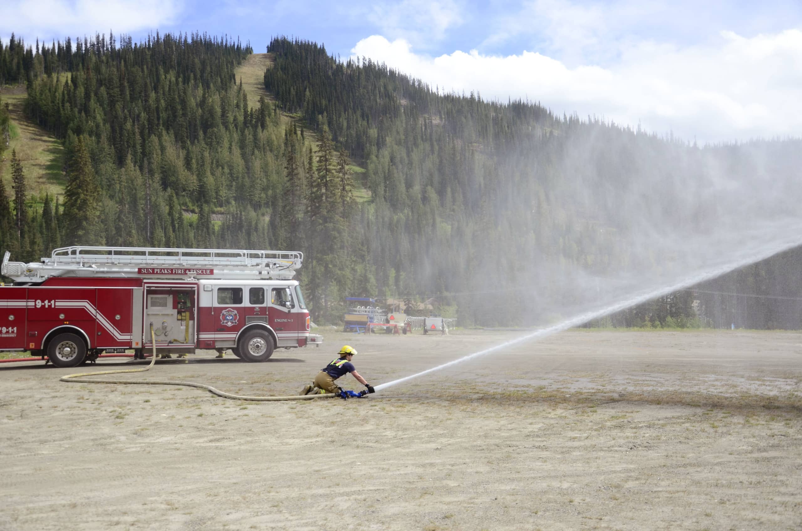 Joss Advocaat mans the hose during training.