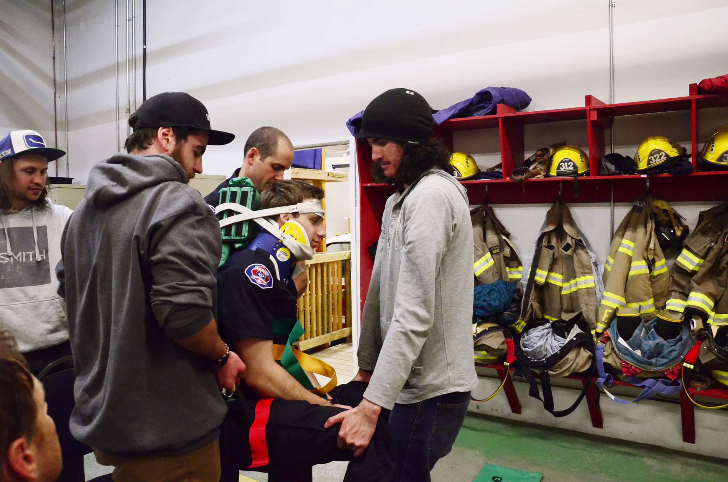 Mick Sandy and Connor Morrison simulate removing a patient from in a sitting position.