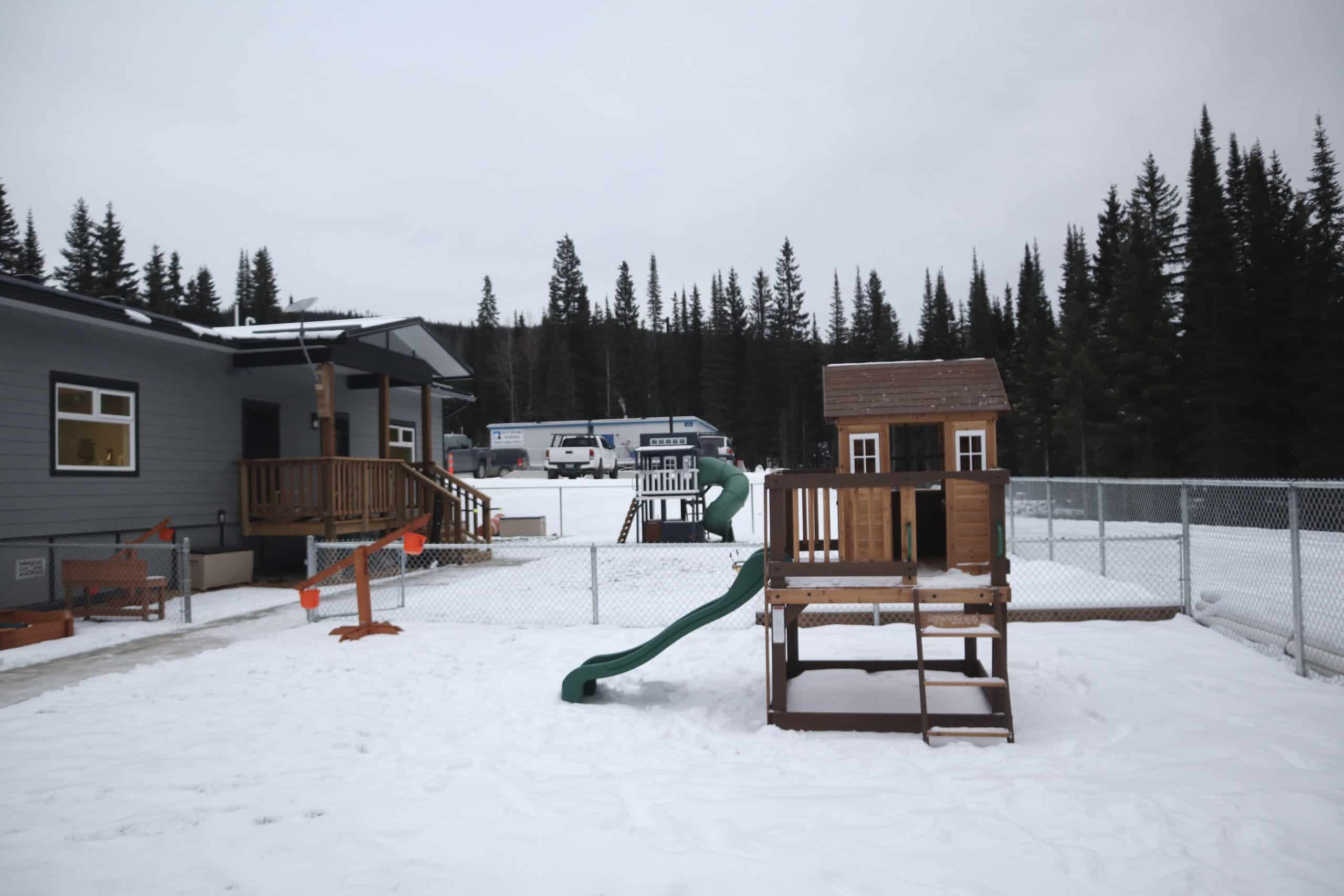 Playground equipment outside during winter.