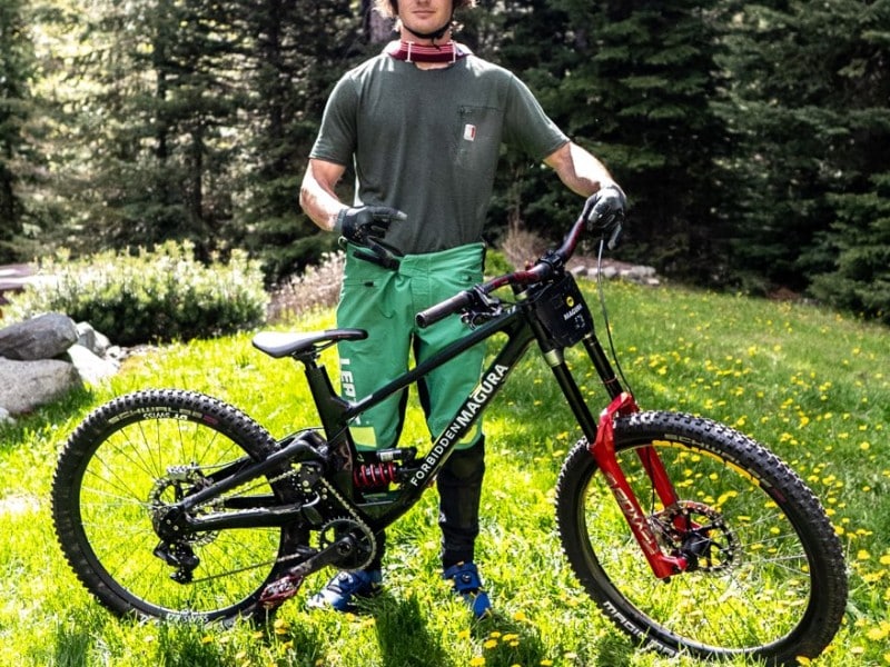 Mountain biker Brock Hawes and his bike. Photo provided by Brock Hawes